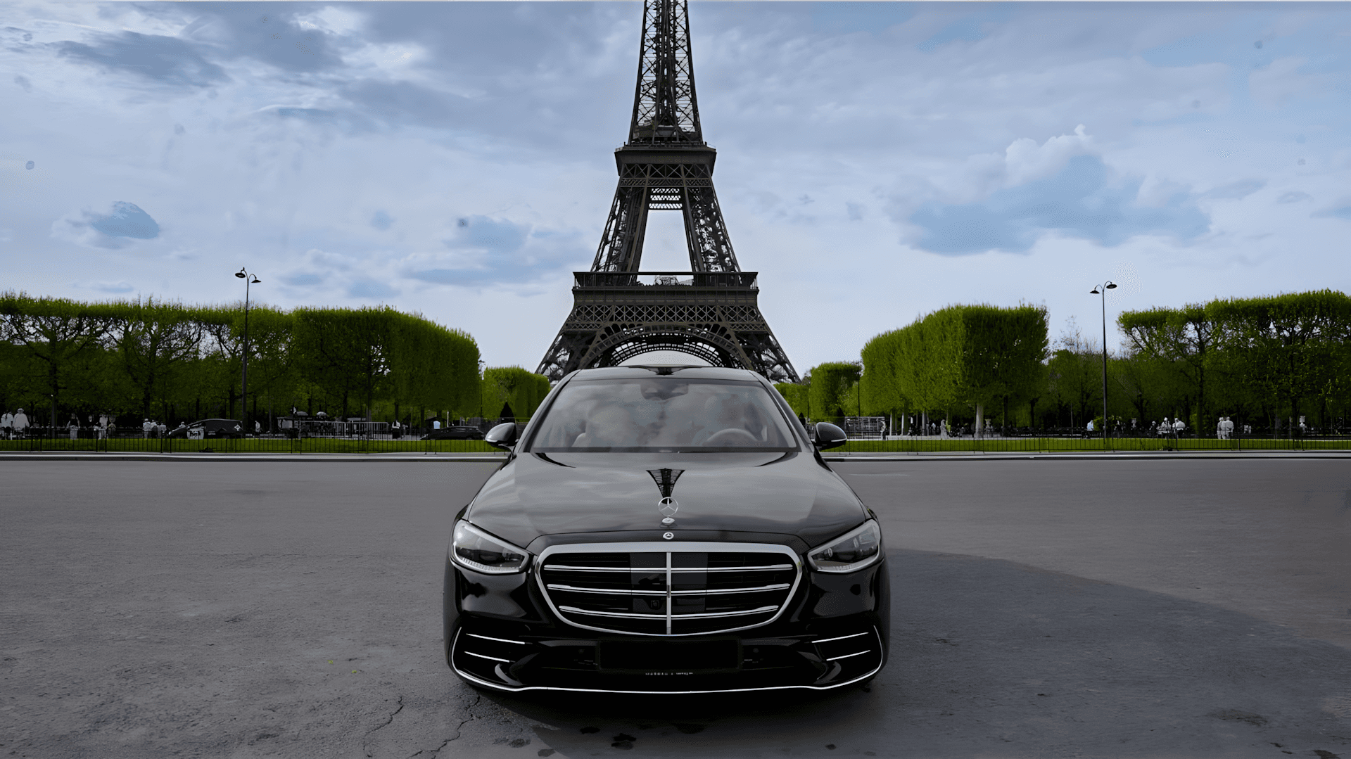 Luxury Limousine in front of Eiffel Tower